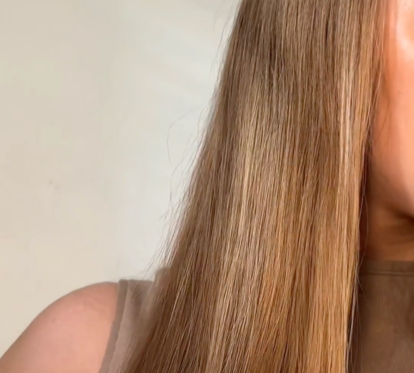 Close-up of long, sleek, and shiny straight hair after styling with the KEEO Smart Glide Straightener, highlighting smooth texture and healthy finish.