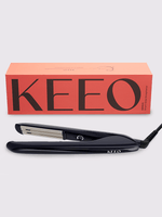 Black hair straightener with Keeo box on a white background